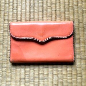 Rebecca Minkoff wallet.  Zipper teeth detail. Peach color. Good used condition